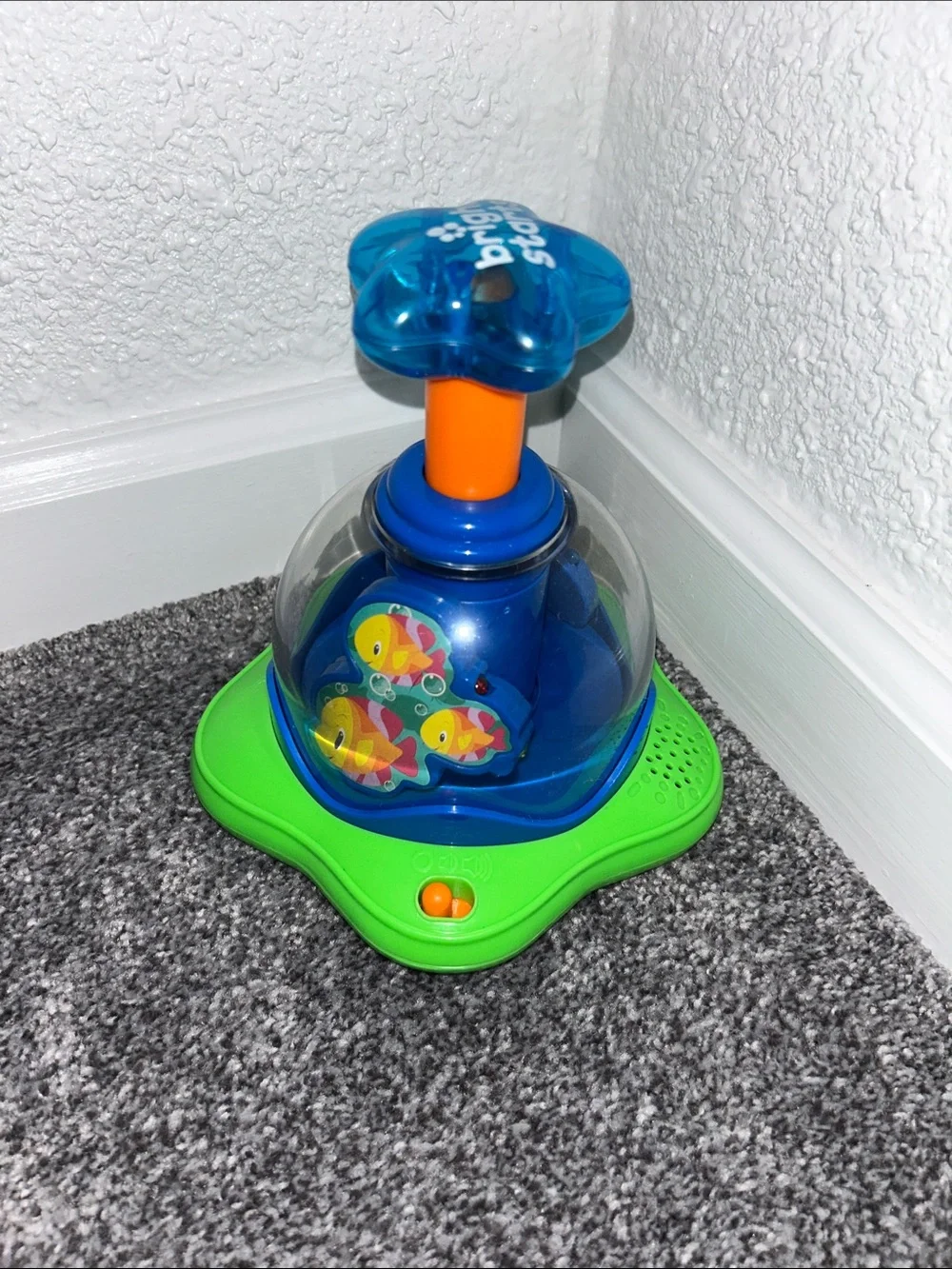 Bright Starts- Press & Glow Spinner Toy